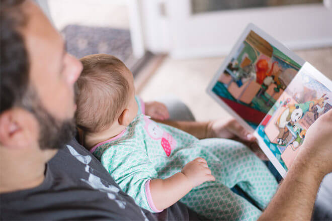 Dads can read the newborn a bedtime story for some quality bonding